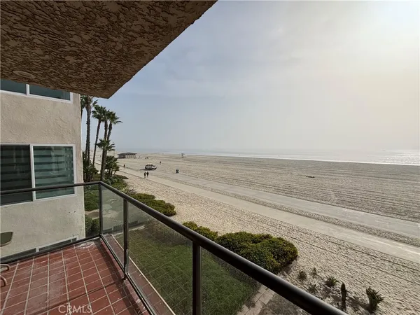 a spacious bedroom with a bed and a cabinets