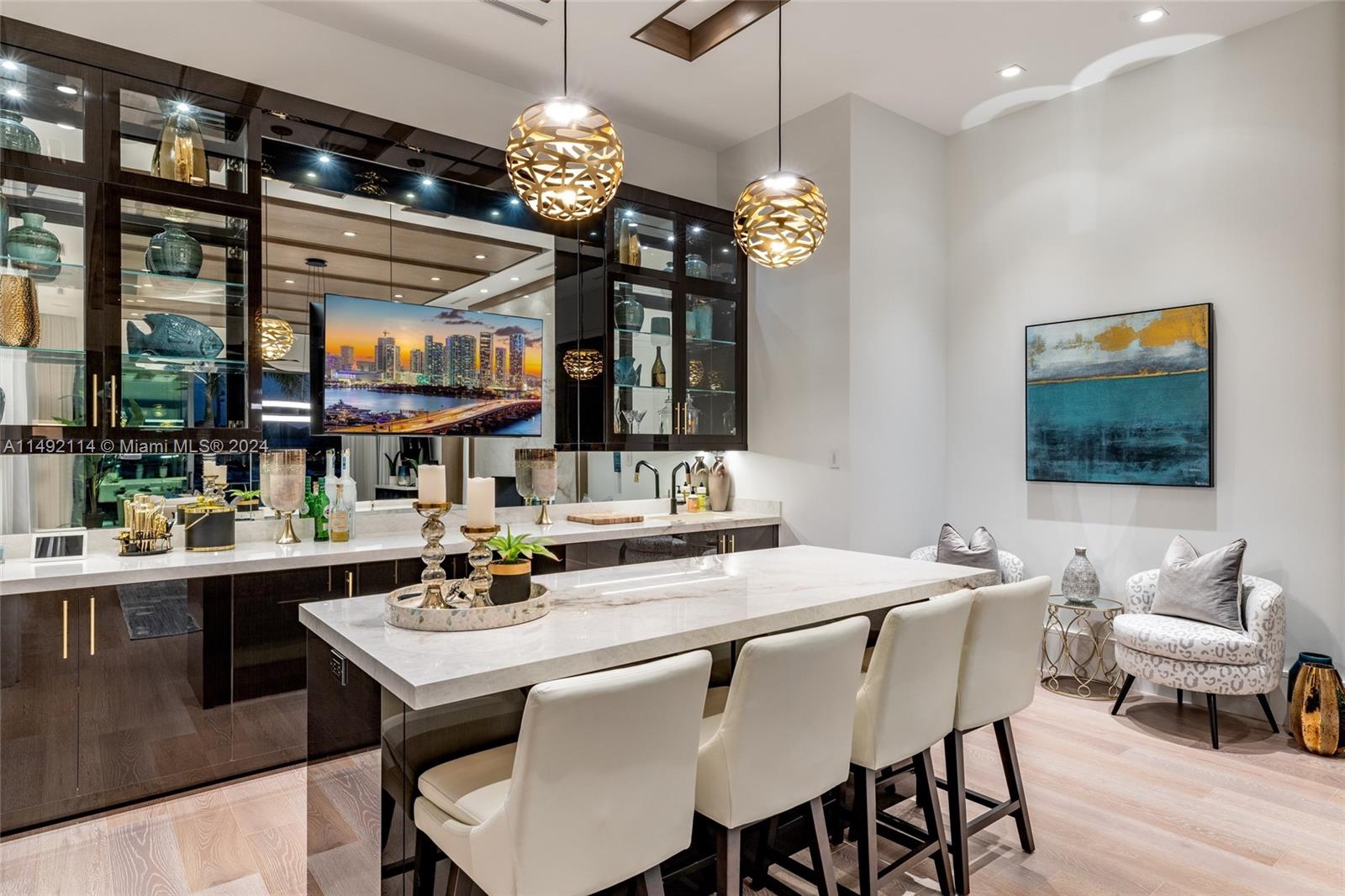 169 West Key Palm Road Boca Raton, FL 33432 - Photo 14 of 27 a view of a dining room with furniture a chandelier and wooden floor