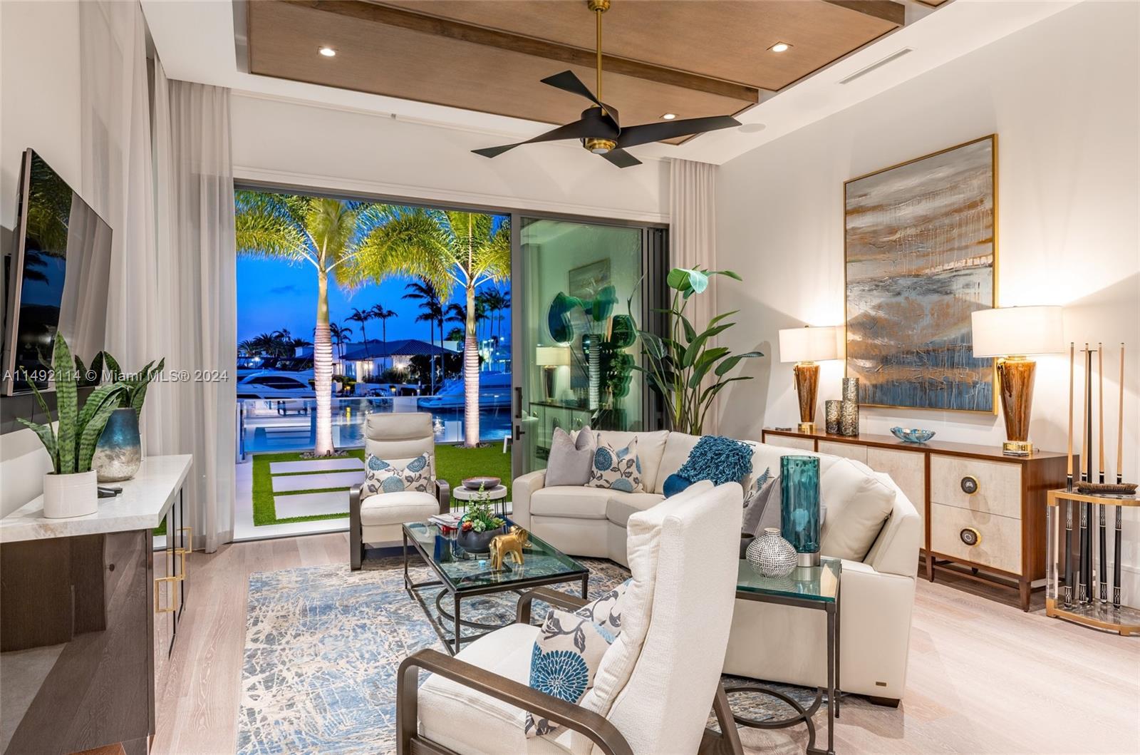 169 West Key Palm Road Boca Raton, FL 33432 - Photo 16 of 27 a living room with fireplace furniture and a flat screen tv