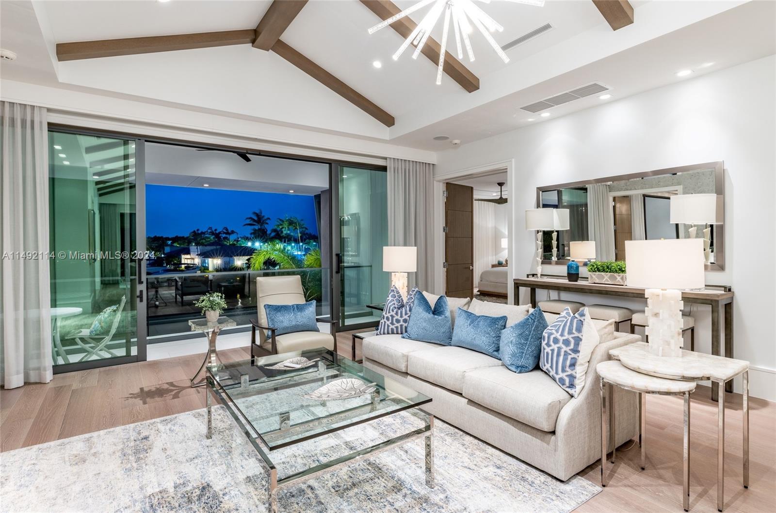 169 West Key Palm Road Boca Raton, FL 33432 - Photo 17 of 27 a living room with furniture and a large window