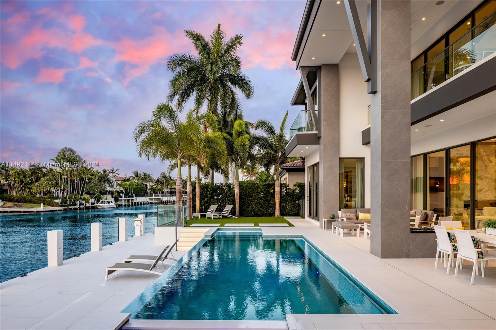 169 West Key Palm Road Boca Raton, FL 33432 - Photo 19 of 27 a swimming pool with outdoor seating and yard