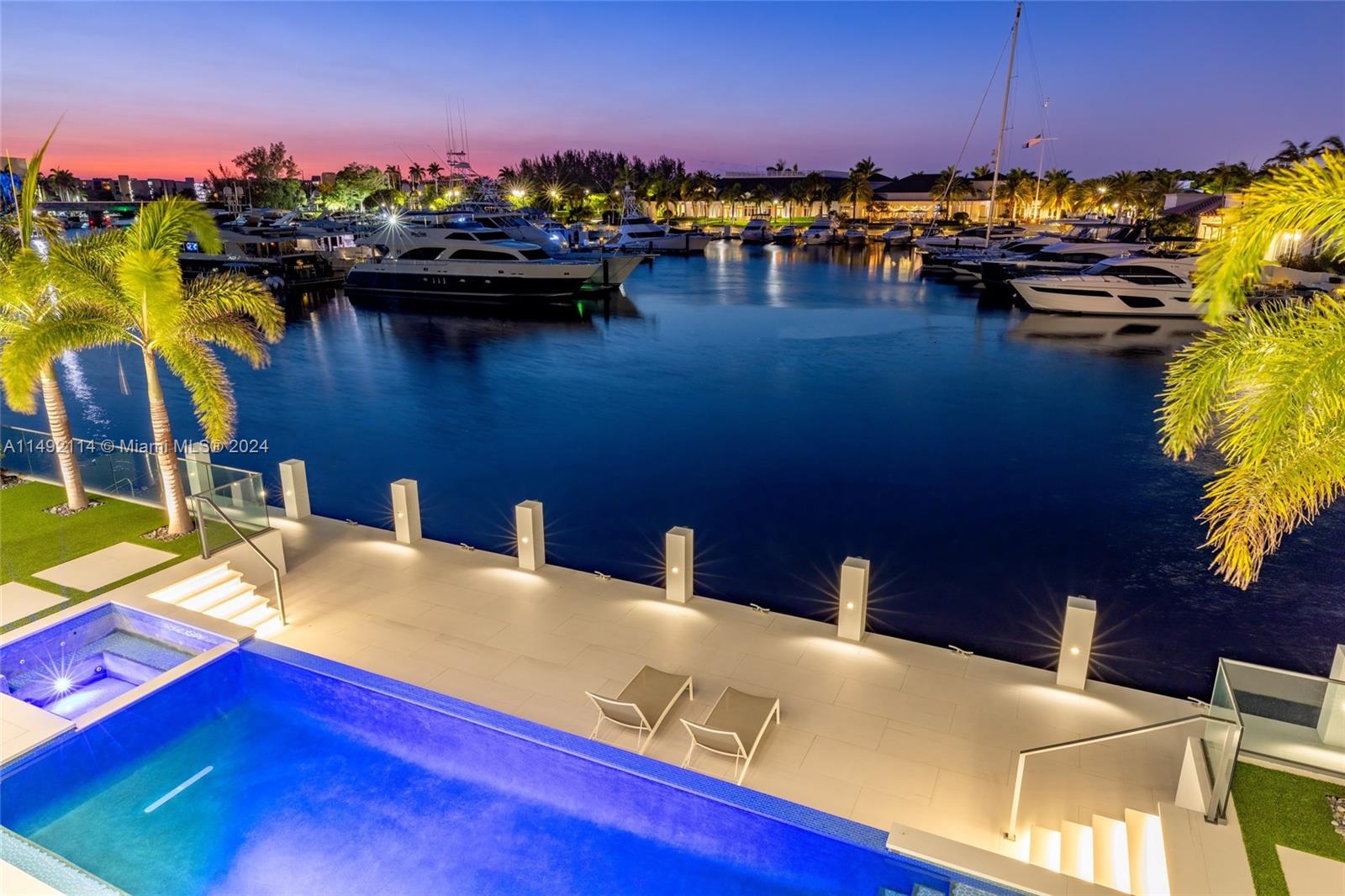 169 West Key Palm Road Boca Raton, FL 33432 - Photo 25 of 27 a view of a lake with a house in the background