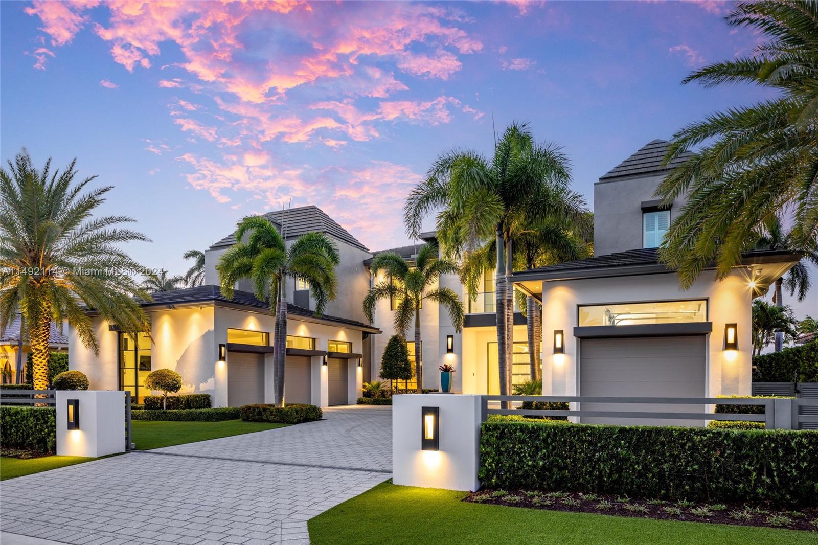 169 West Key Palm Road Boca Raton, FL 33432 - Photo 3 of 27 a front view of a house with a garden