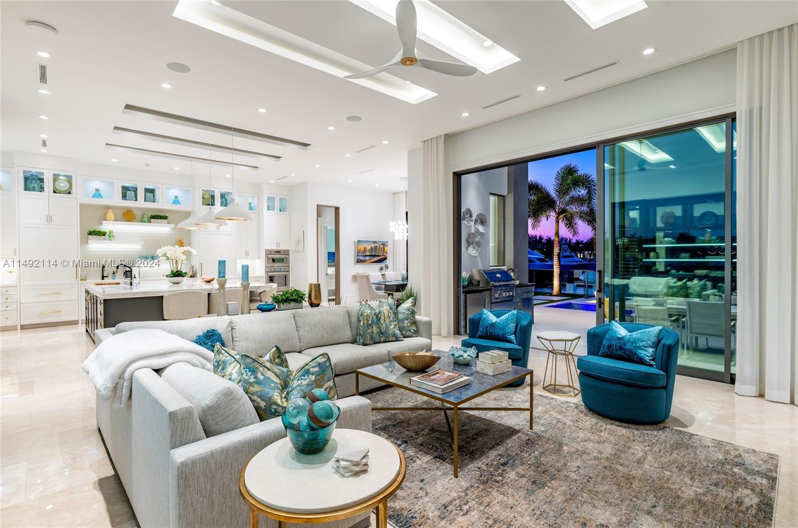 169 West Key Palm Road Boca Raton, FL 33432 - Photo 9 of 27 a living room with furniture and a potted plant