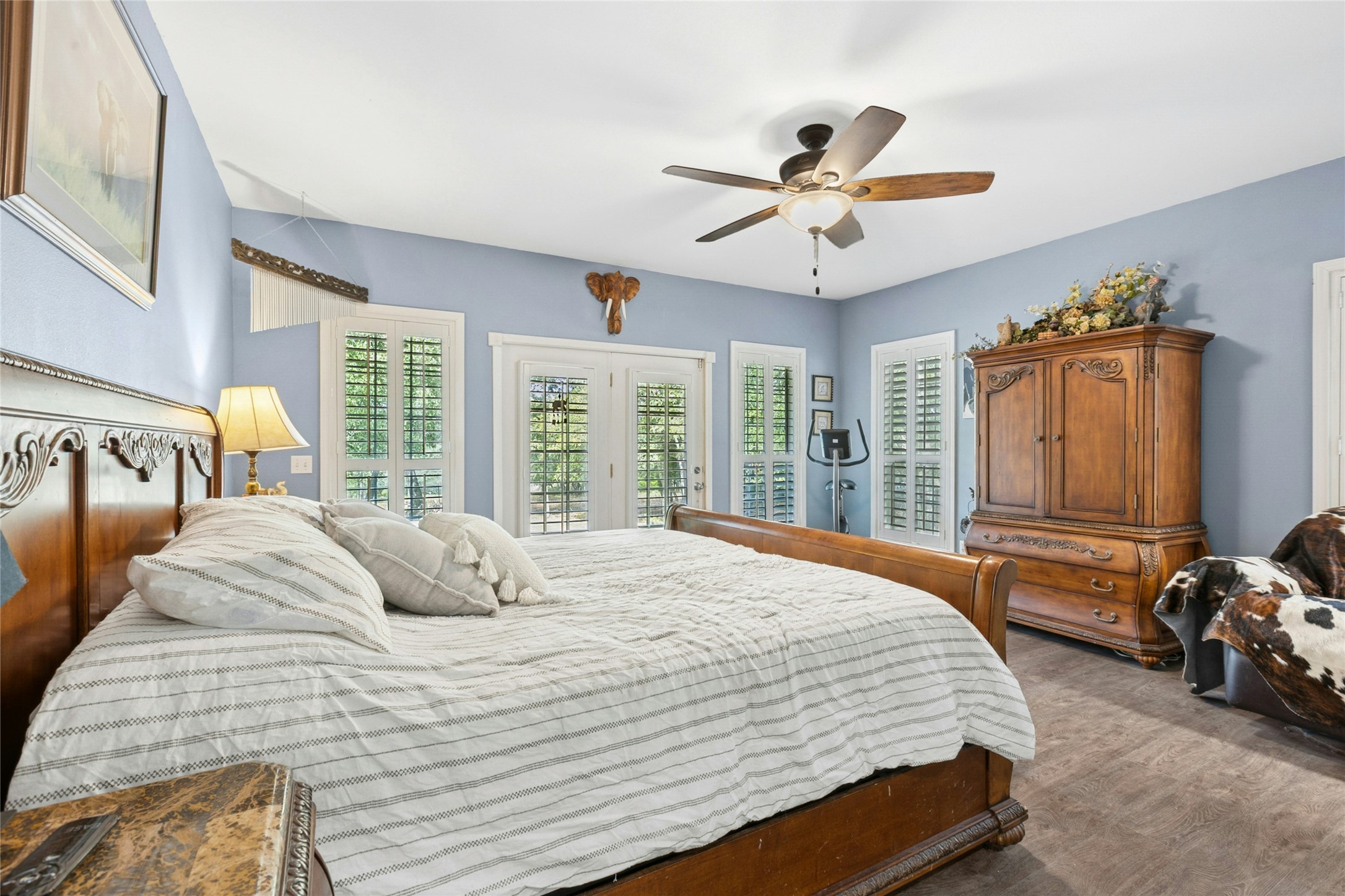 412 Woody Hollow Road Luling, TX 78648 - Photo 15 of 33 Bedroom with ceiling fan and wood finished floors