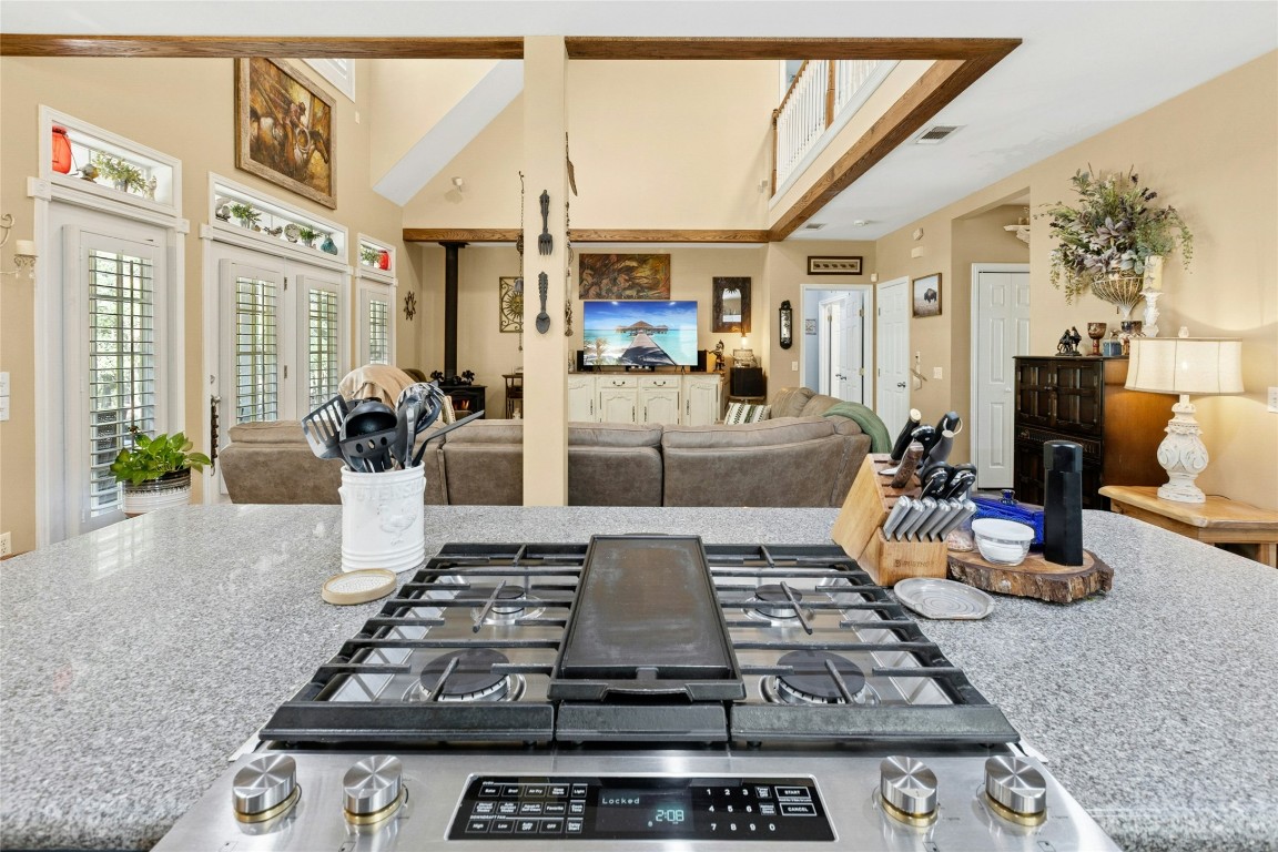 412 Woody Hollow Road Luling, TX 78648 - Photo 39 of 39 a kitchen with a stove and a view of living room