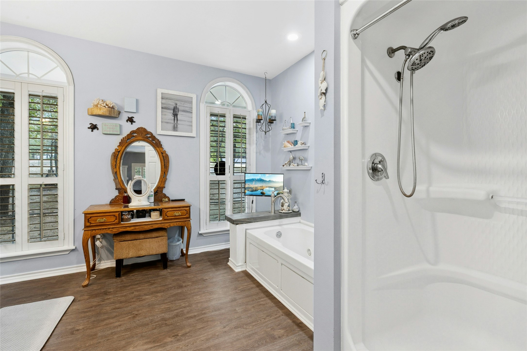 412 Woody Hollow Road Luling, TX 78648 - Photo 17 of 33 Full bath with a garden tub, dark wood-style flooring, a shower, recessed lighting, and vanity