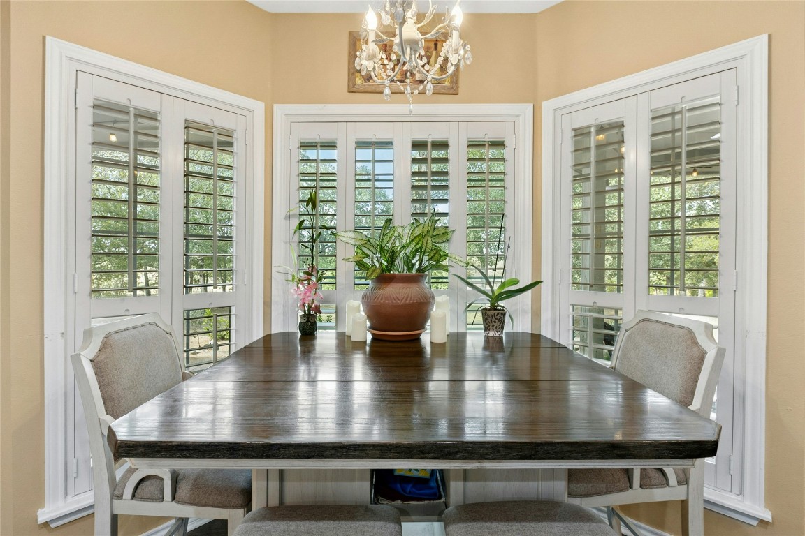 412 Woody Hollow Road Luling, TX 78648 - Photo 18 of 39 a view of a dining room with furniture and window