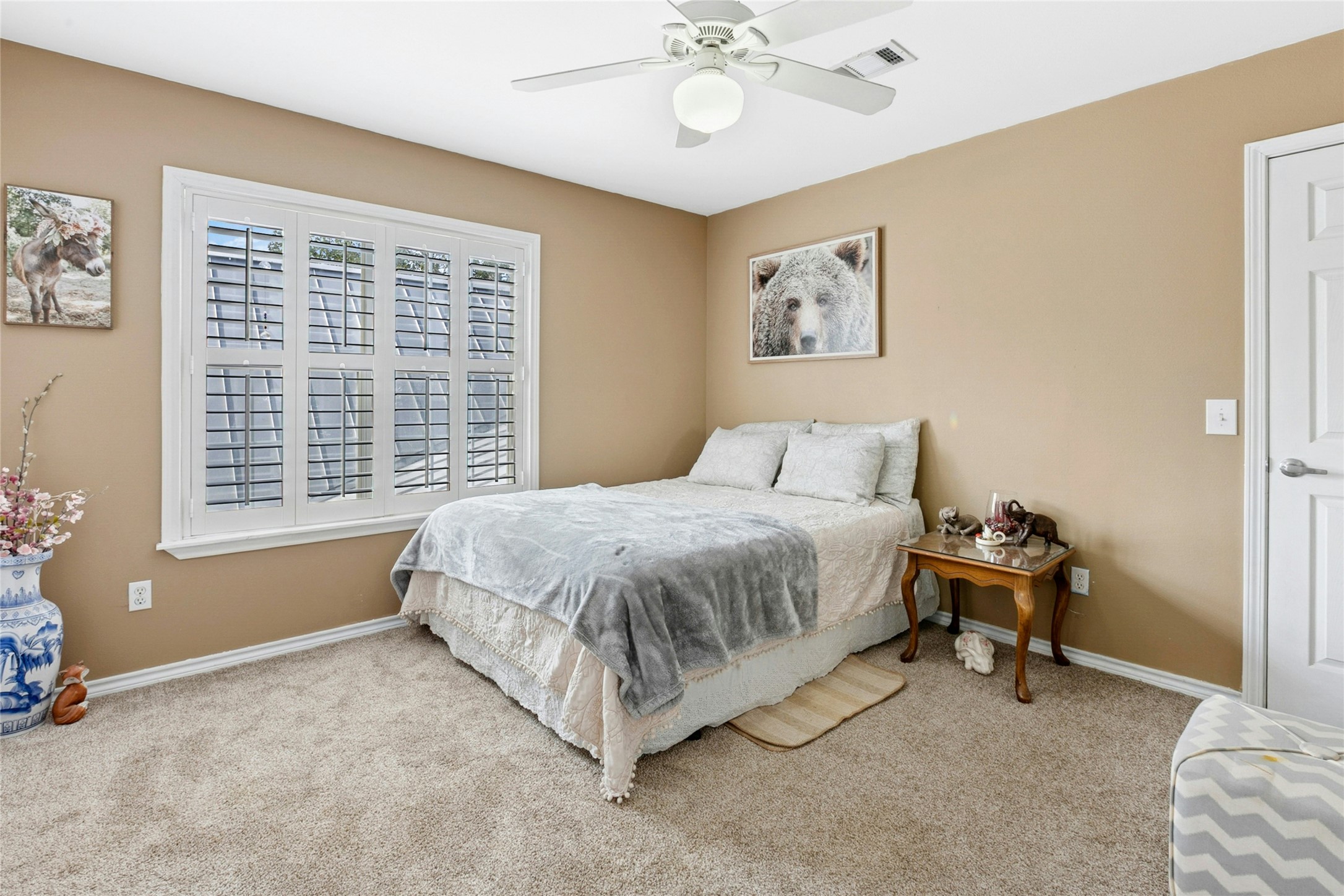 412 Woody Hollow Road Luling, TX 78648 - Photo 19 of 33 Carpeted bedroom featuring baseboards and ceiling fan