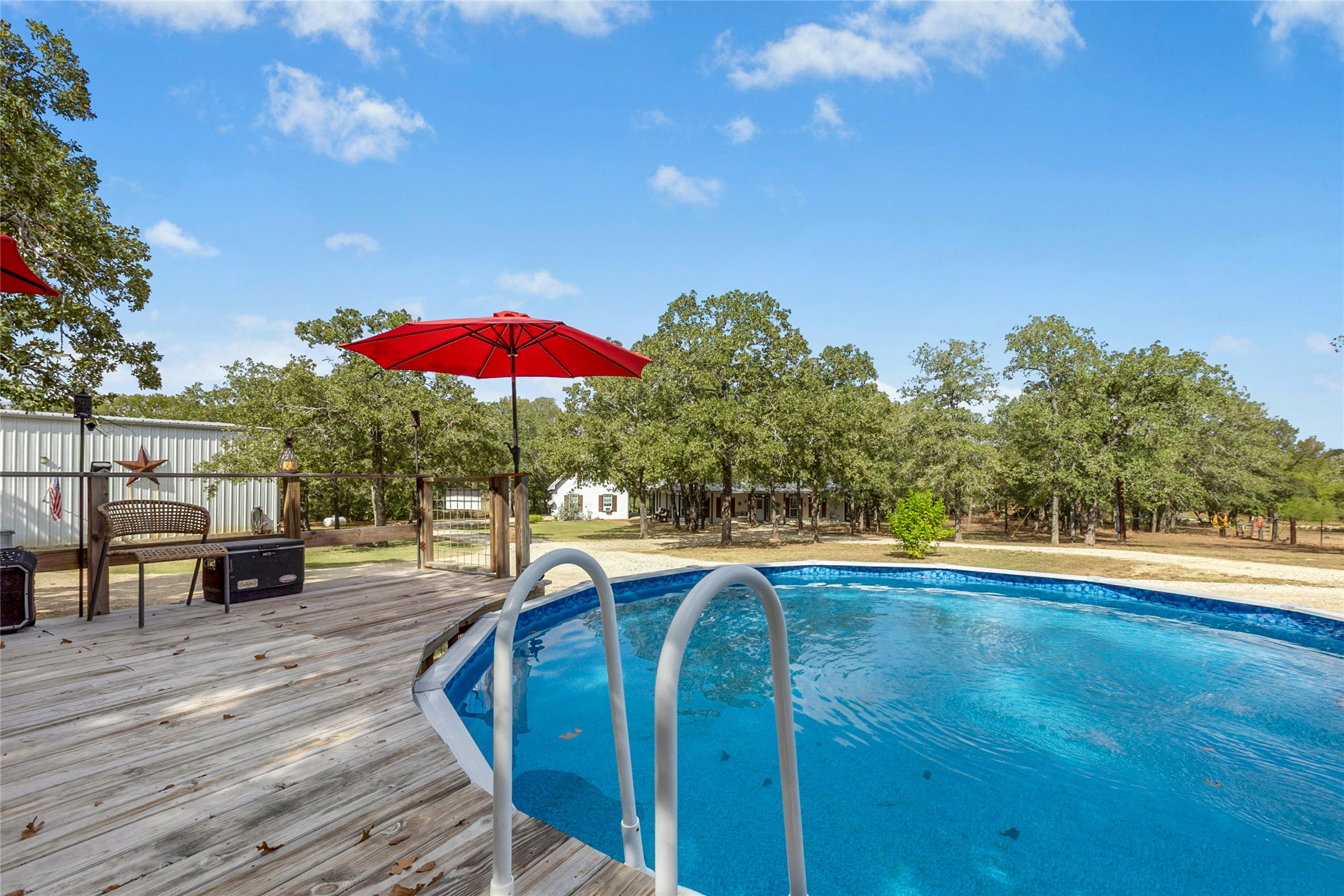412 Woody Hollow Road Luling, TX 78648 - Photo 26 of 33 Swimming pool featuring a custom deck
