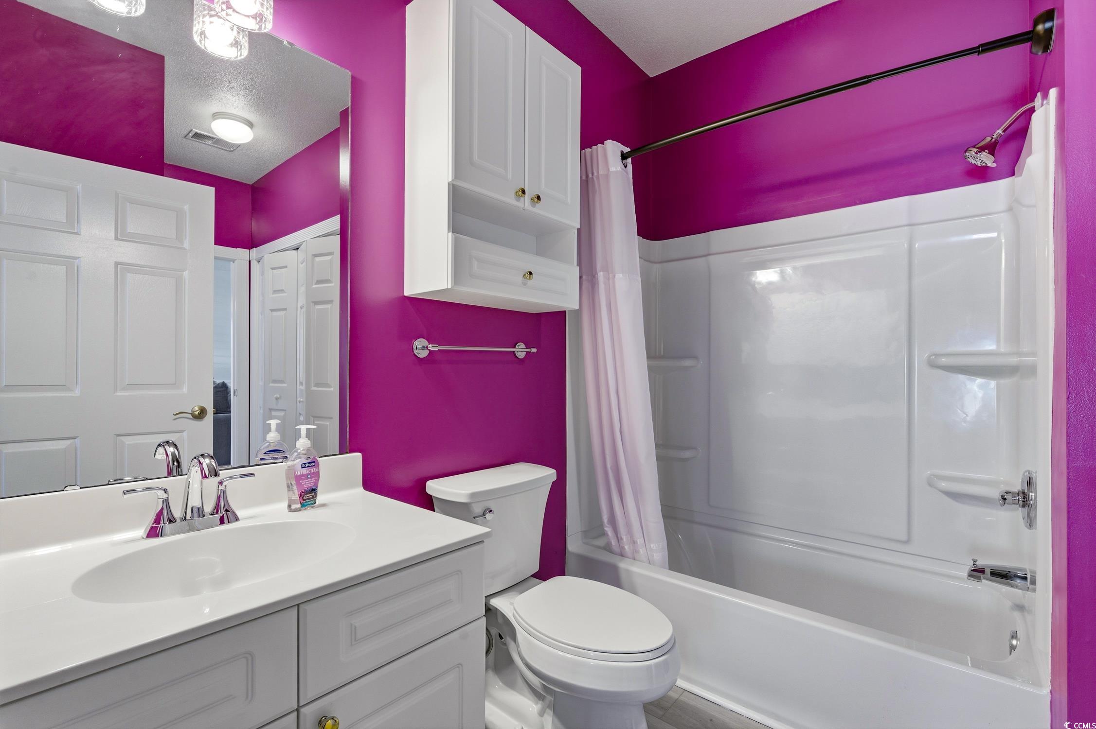 4839 Carnation Circle, Unit 305 Myrtle Beach, SC 29577 - Photo 15 of 24 Bathroom with shower / tub combo and vanity