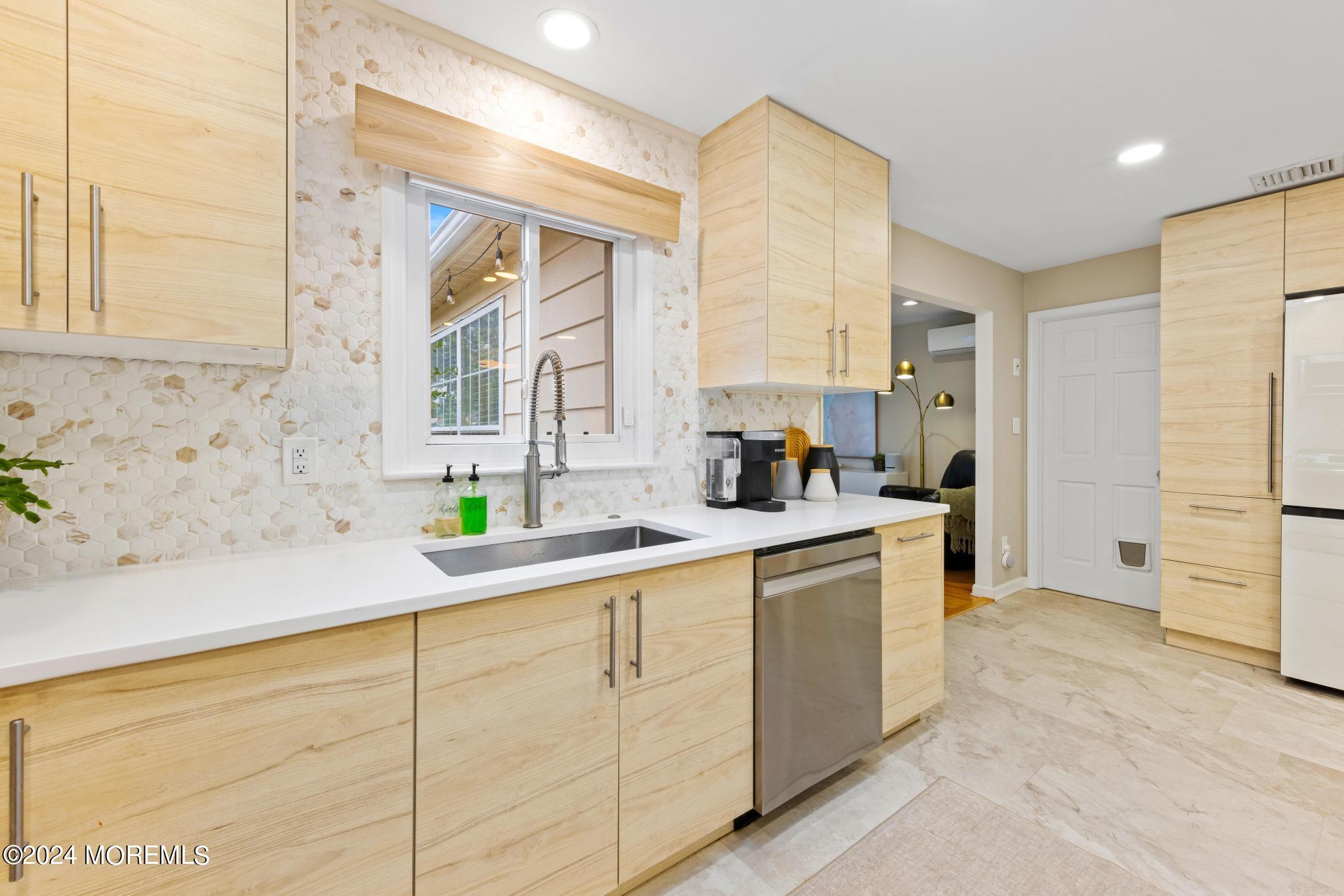 14 Seaton Road Toms River, NJ 08755 - Photo 16 of 59 a kitchen with a sink and cabinets
