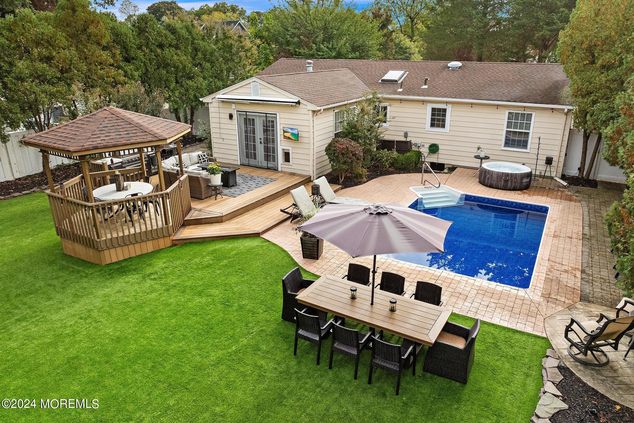 14 Seaton Road Toms River, NJ 08755 - Photo 2 of 59 a front view of a house with garden and sitting area