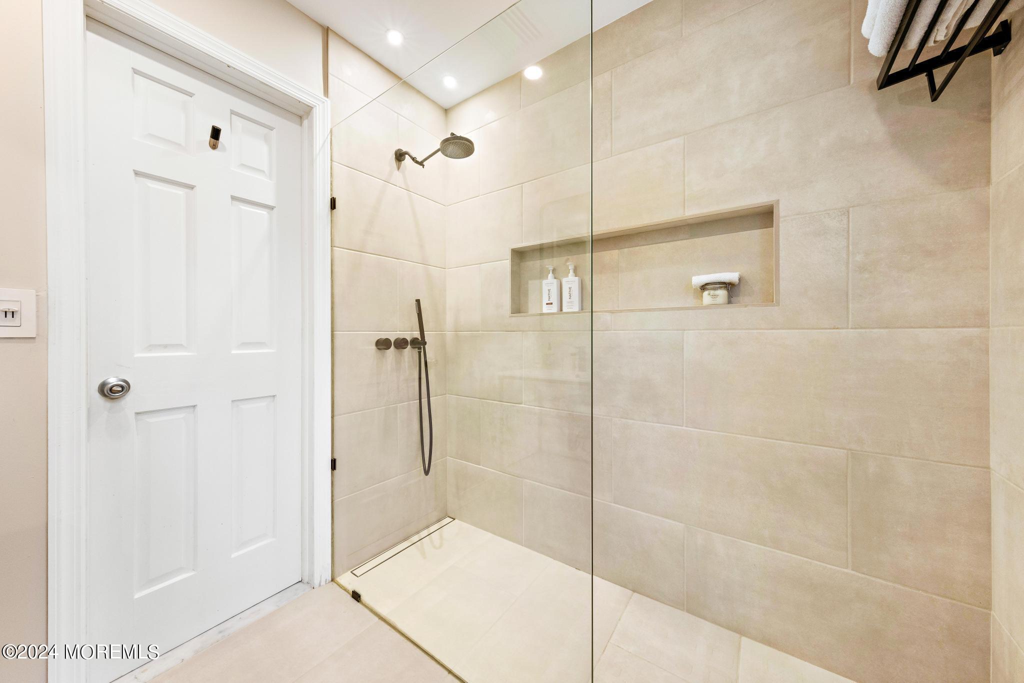 14 Seaton Road Toms River, NJ 08755 - Photo 21 of 59 a bathroom with a shower and a glass door
