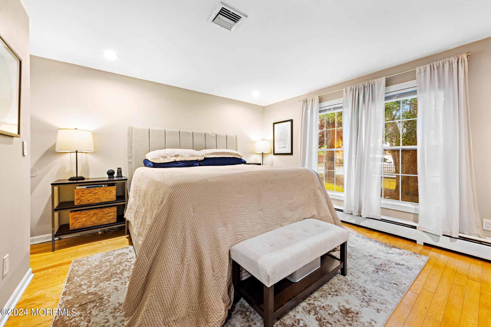 14 Seaton Road Toms River, NJ 08755 - Photo 24 of 59 a bedroom with a bed and wooden floor