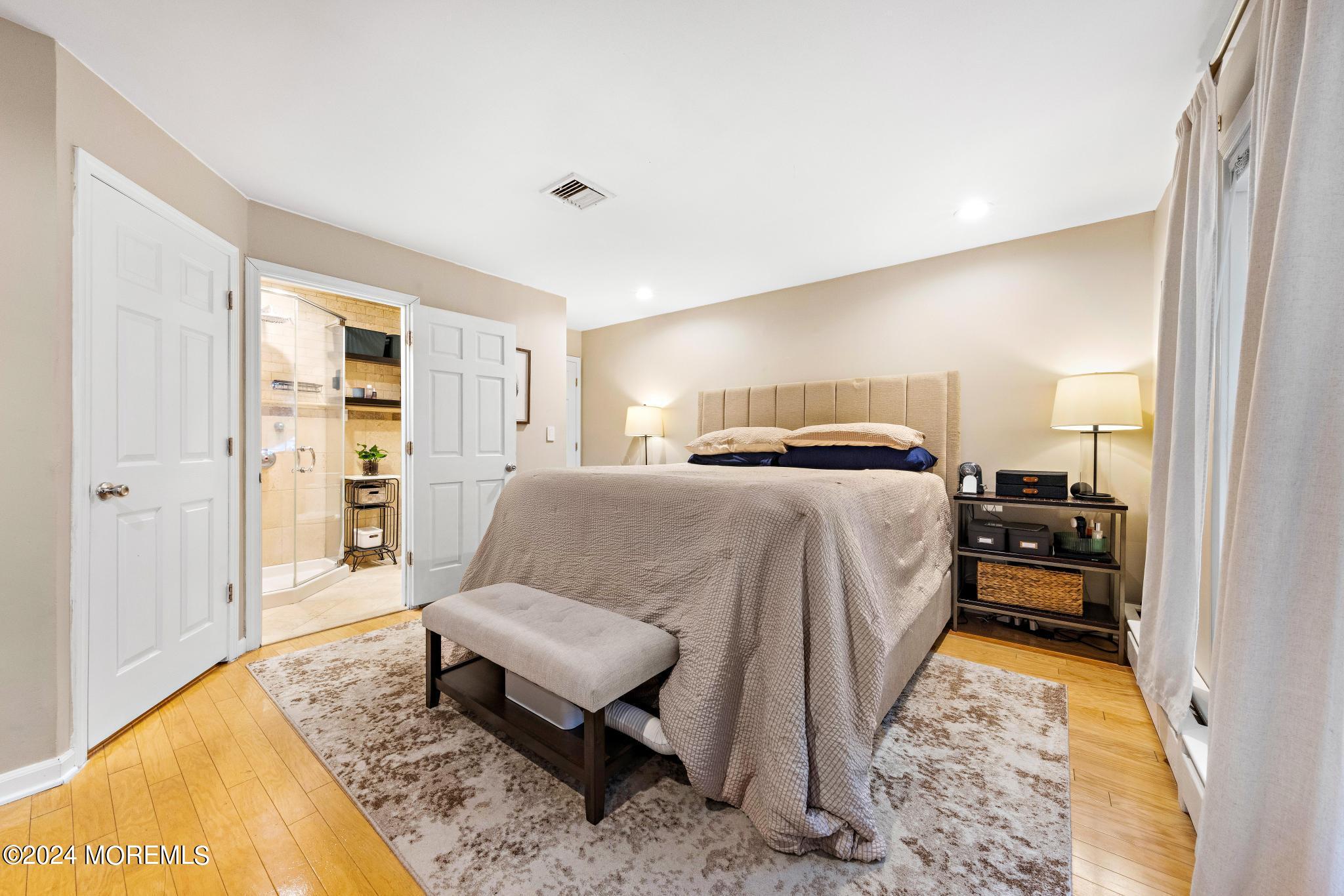 14 Seaton Road Toms River, NJ 08755 - Photo 25 of 59 a bedroom with a bed and wooden floor