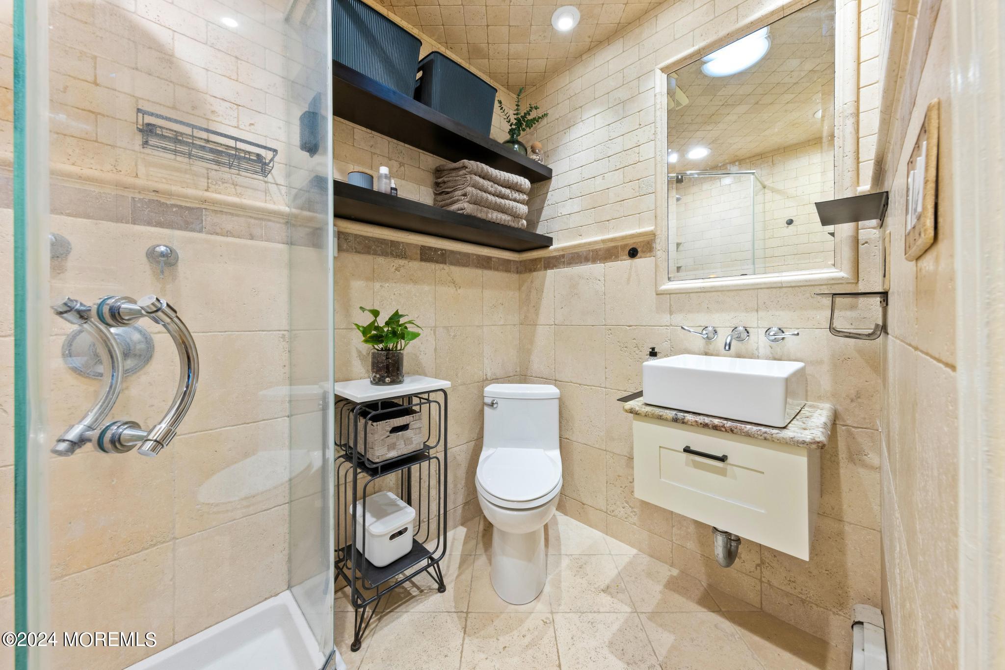 14 Seaton Road Toms River, NJ 08755 - Photo 26 of 59 a bathroom with a sink a toilet and shower