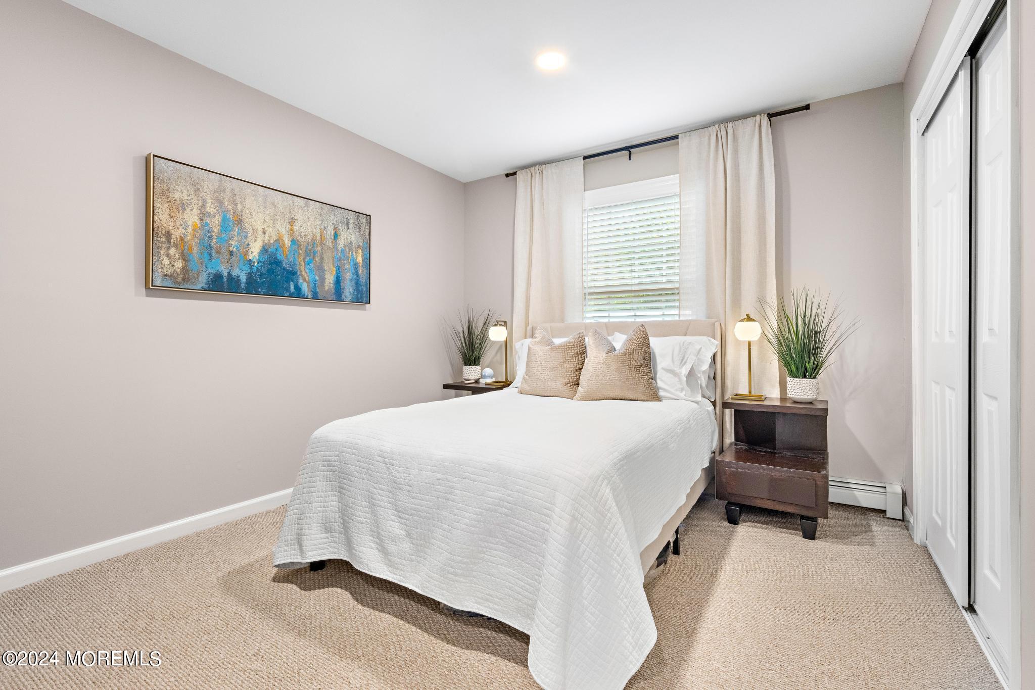 14 Seaton Road Toms River, NJ 08755 - Photo 29 of 59 a bedroom with a bed and a painting on the wall