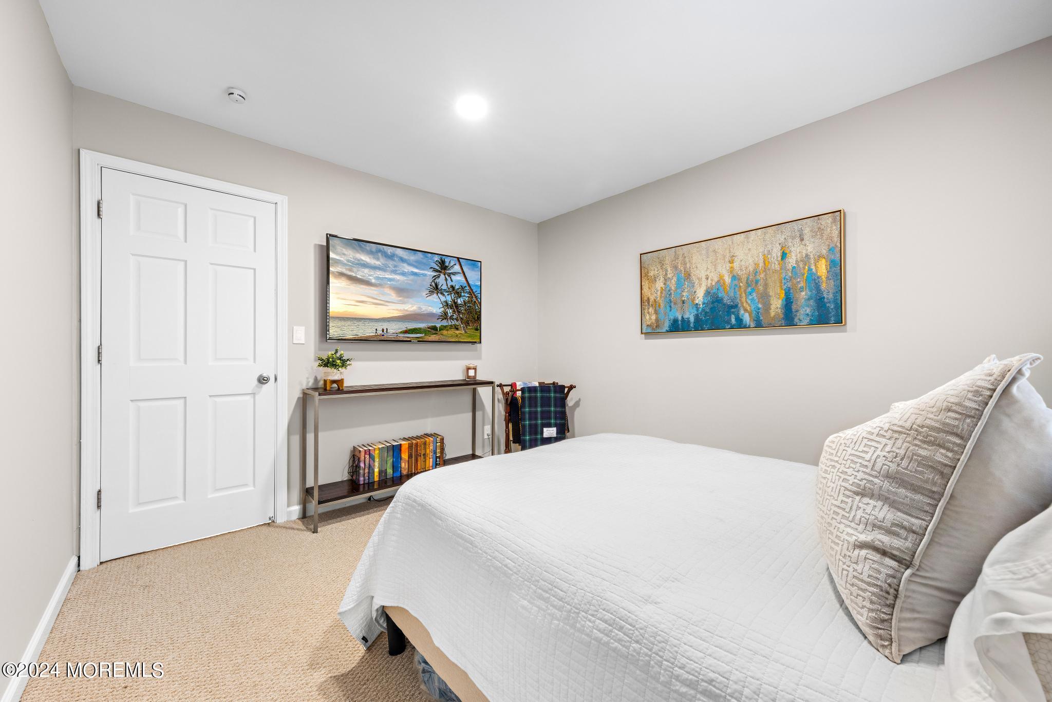 14 Seaton Road Toms River, NJ 08755 - Photo 30 of 59 a bedroom with a bed and a couch