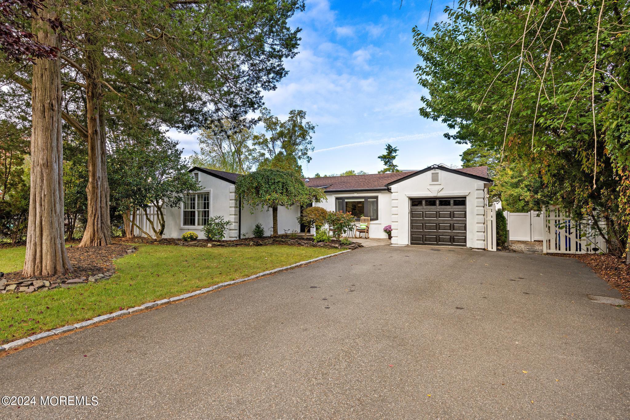 14 Seaton Road Toms River, NJ 08755 - Photo 3 of 59 a front view of a house with a yard and trees