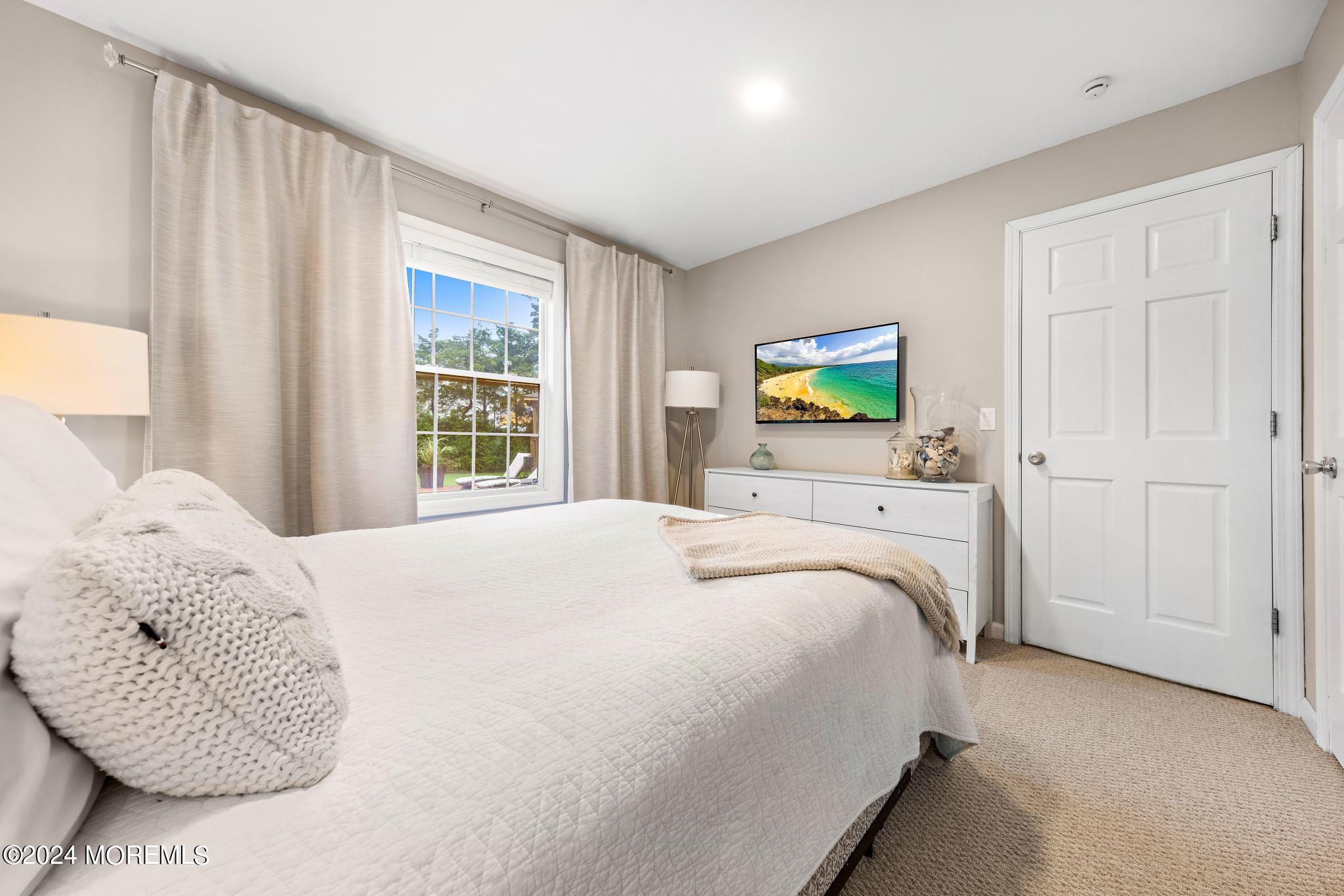 14 Seaton Road Toms River, NJ 08755 - Photo 32 of 59 a bedroom with a bed a window and painting on the wall