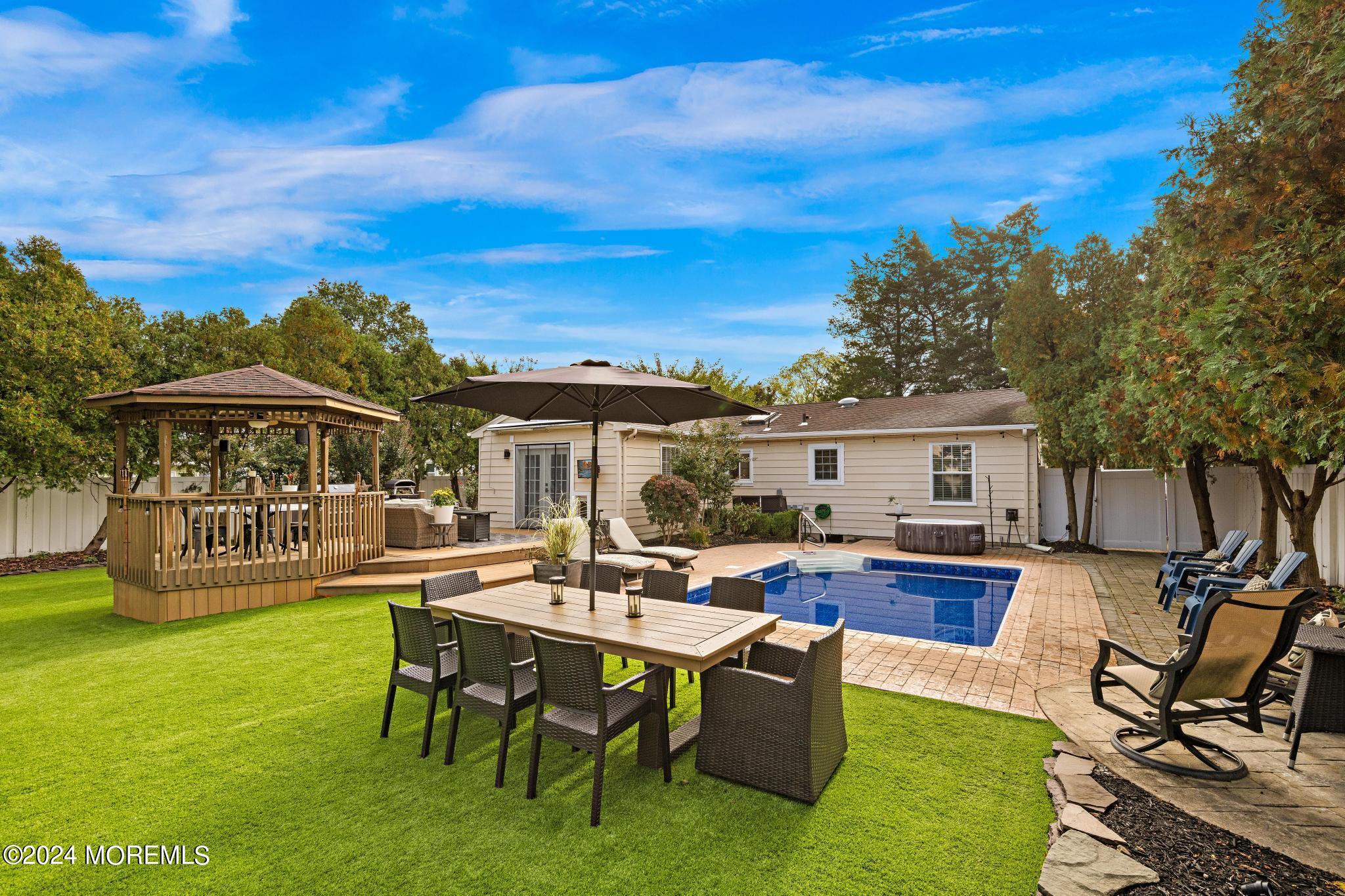 14 Seaton Road Toms River, NJ 08755 - Photo 38 of 59 a view of a house with backyard sitting area and garden