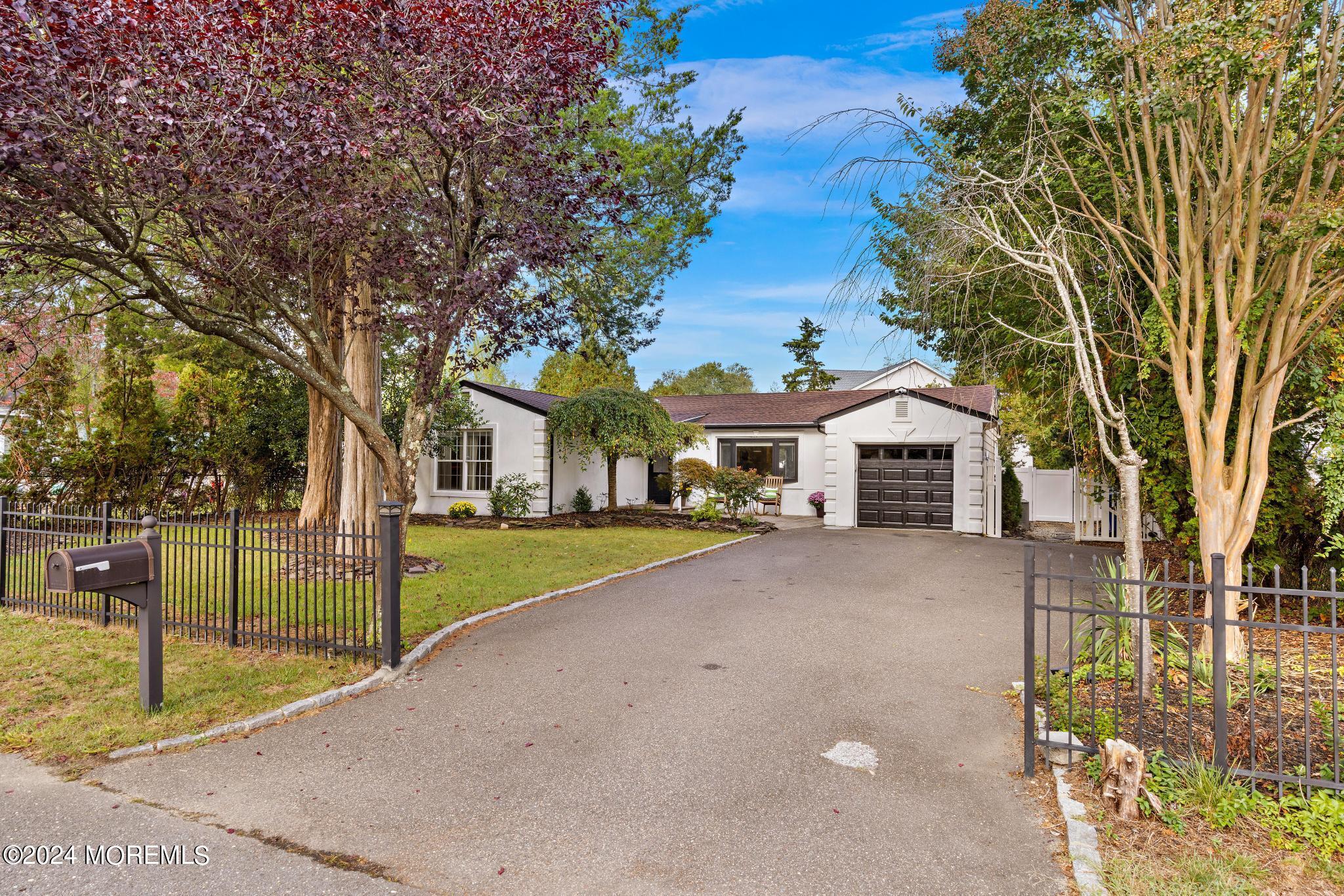 14 Seaton Road Toms River, NJ 08755 - Photo 4 of 59 a front view of a house with a yard and garage