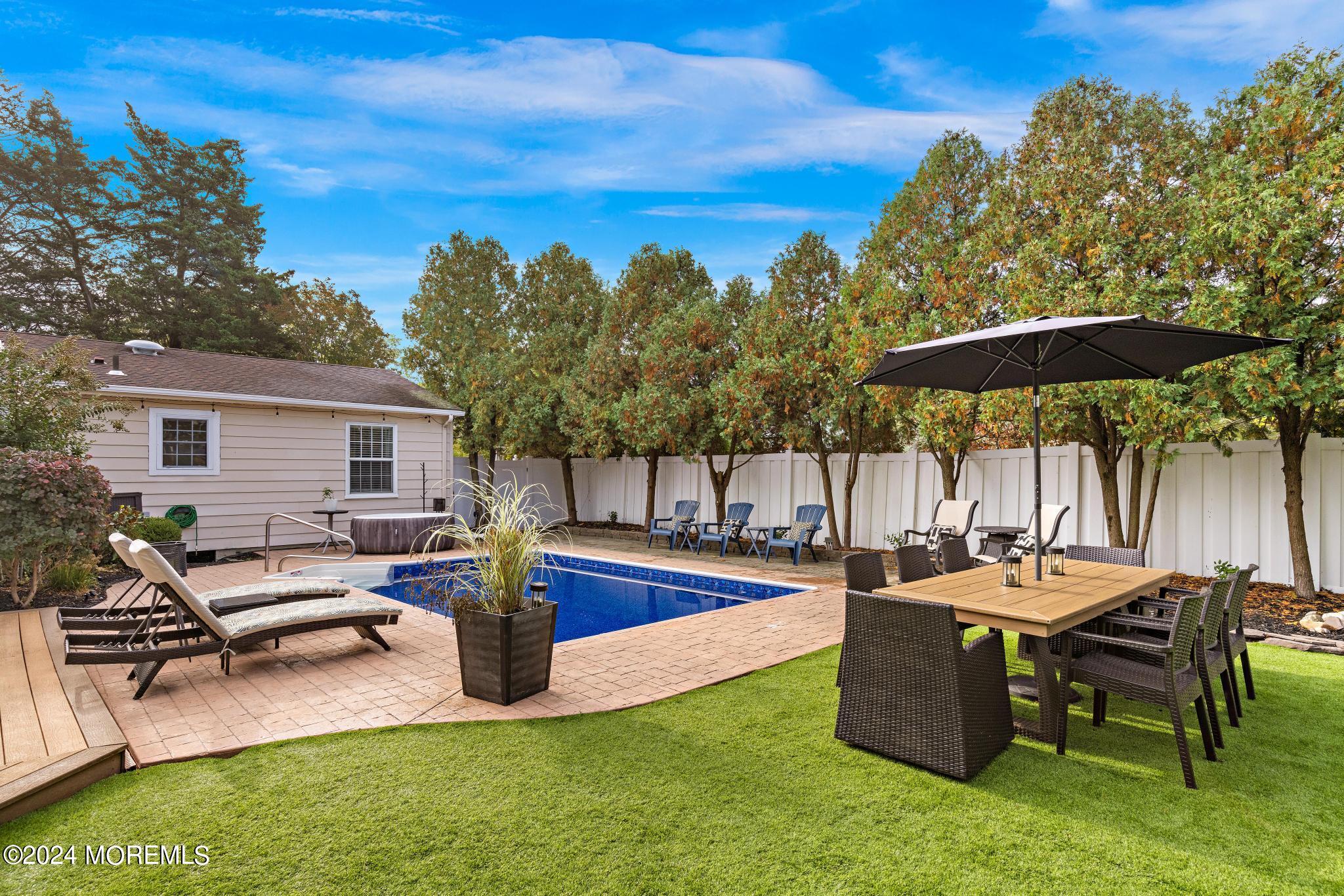 14 Seaton Road Toms River, NJ 08755 - Photo 41 of 59 a view of a patio with chairs and a table