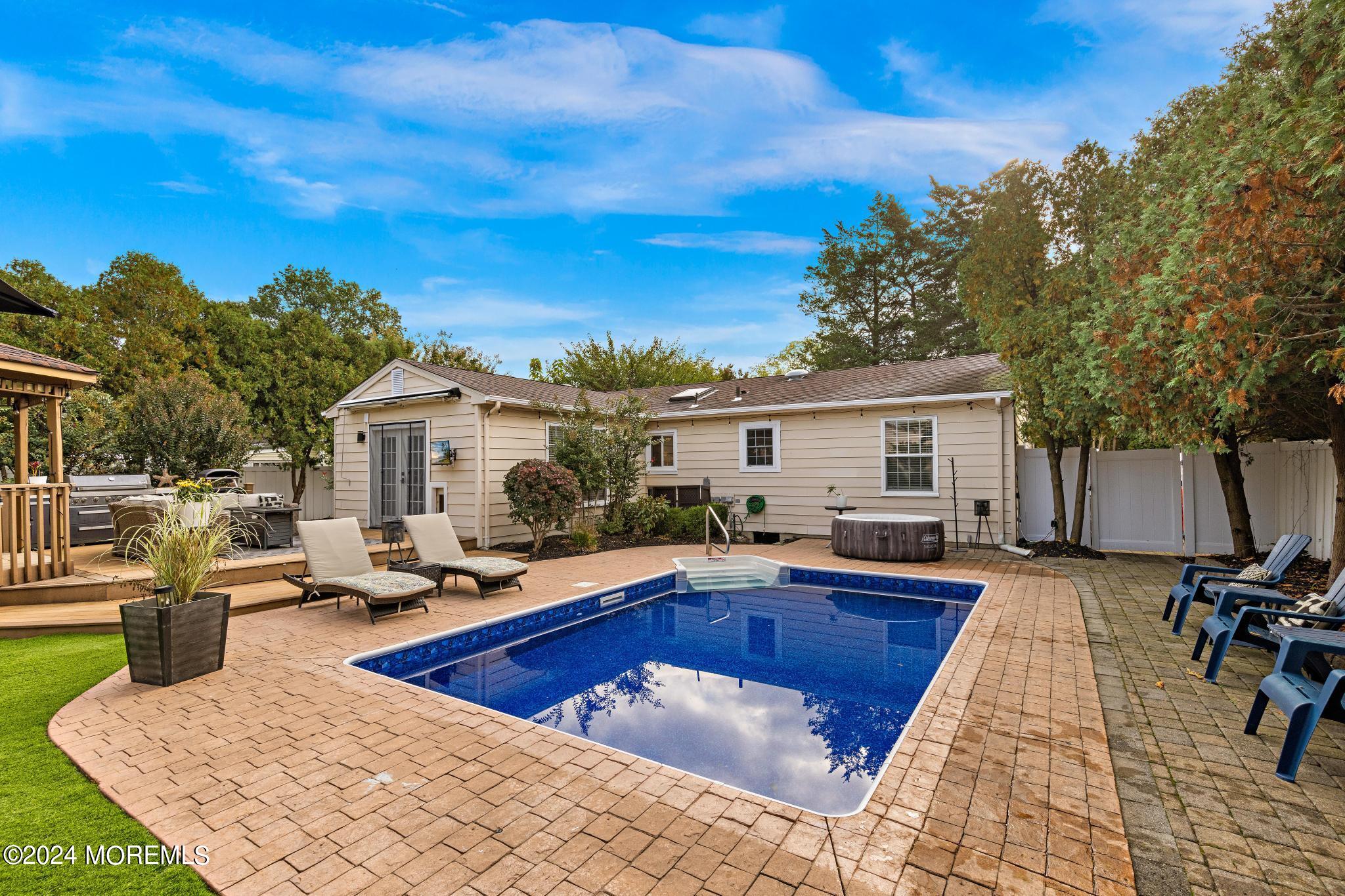 14 Seaton Road Toms River, NJ 08755 - Photo 43 of 59 a view of a house with swimming pool and sitting area