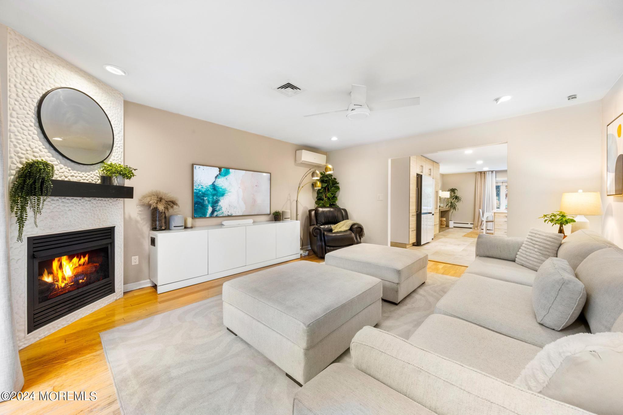 14 Seaton Road Toms River, NJ 08755 - Photo 9 of 59 a living room with furniture a fireplace and a flat screen tv