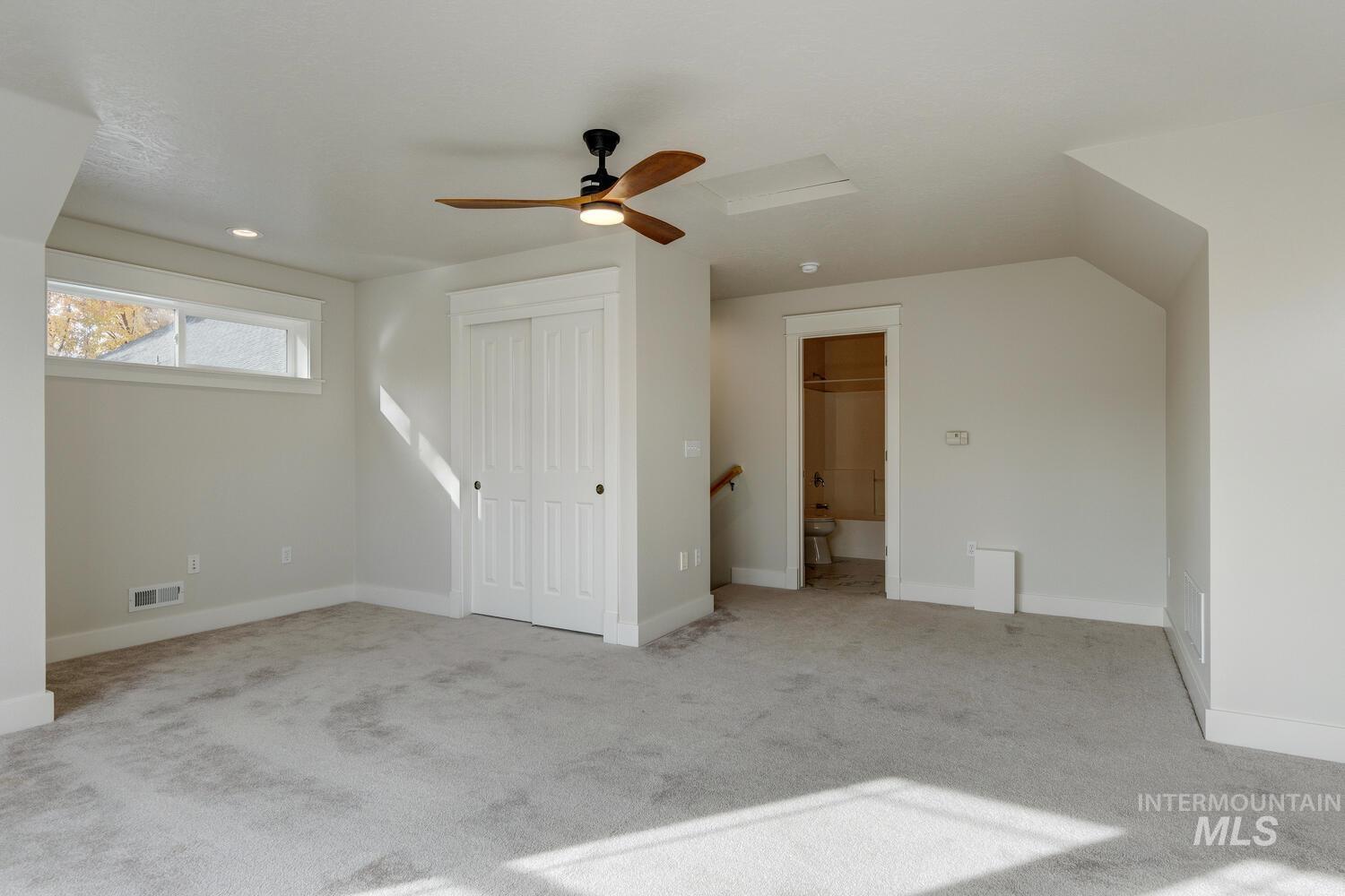 5855 West Farm Mkt Road Garden City, ID 83714 - Photo 28 of 50 Bonus room featuring light carpet and ceiling fan