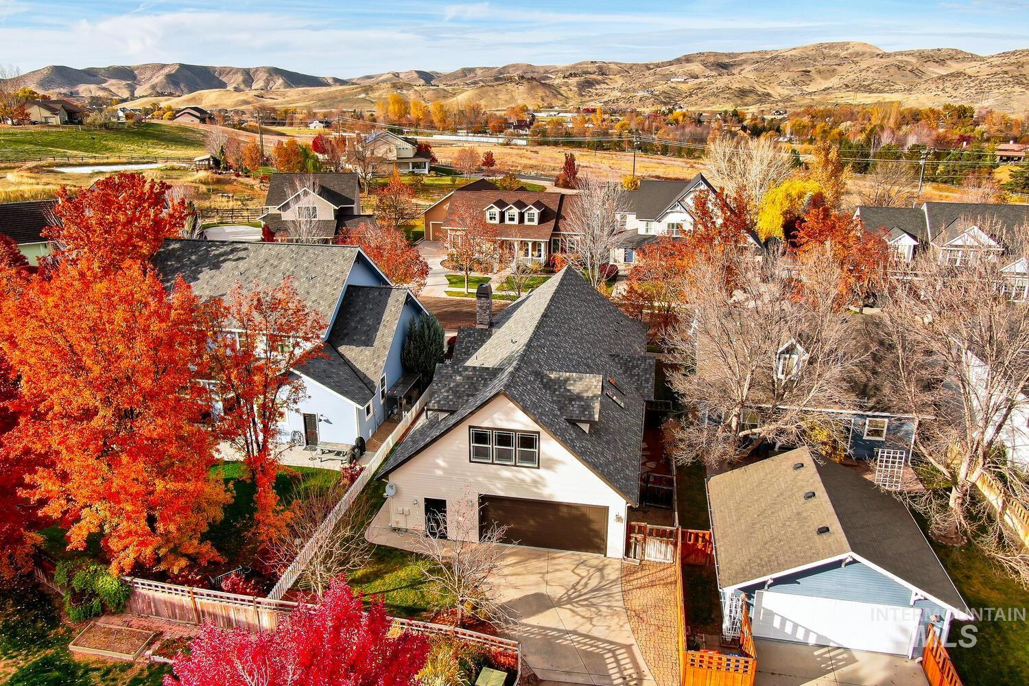 5855 West Farm Mkt Road Garden City, ID 83714 - Photo 36 of 50 Aerial view of residential area featuring a mountain backdrop