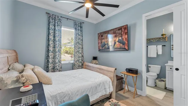 a bedroom with a large bed and a window