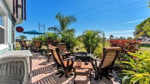 a view of a chairs and table in the patio