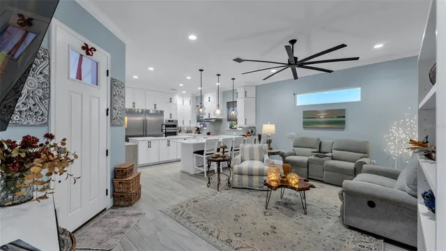 a living room with furniture and a potted plant