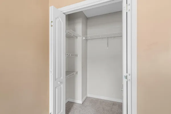 a view of a hallway with closet
