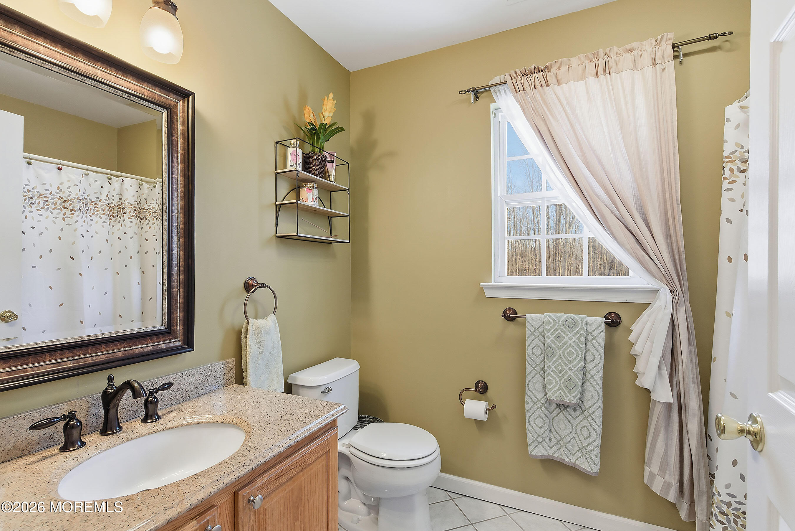 9 Kindling Way Jackson, NJ 08527 - Photo 27 of 33 a bathroom with a granite countertop sink toilet and a mirror