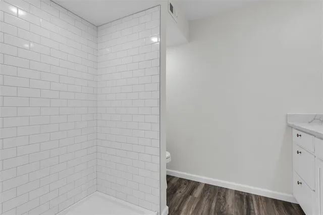 a bathroom with a sink and vanity