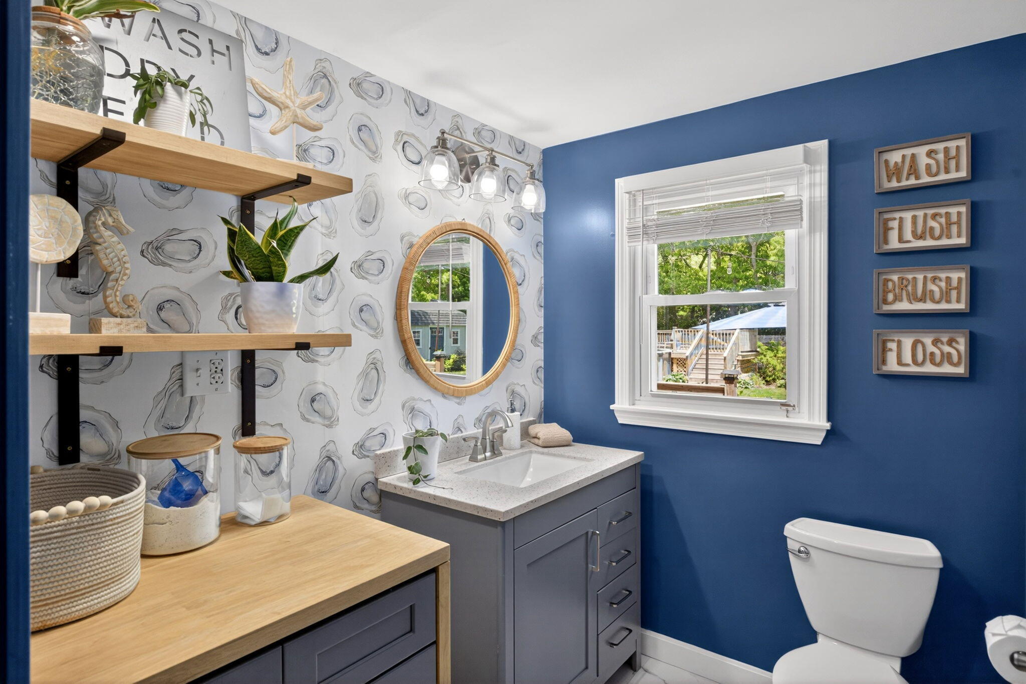 12 Sarah Lawrence Road Sandwich, MA 02563 - Photo 14 of 54 a bathroom with a toilet a sink and a mirror
