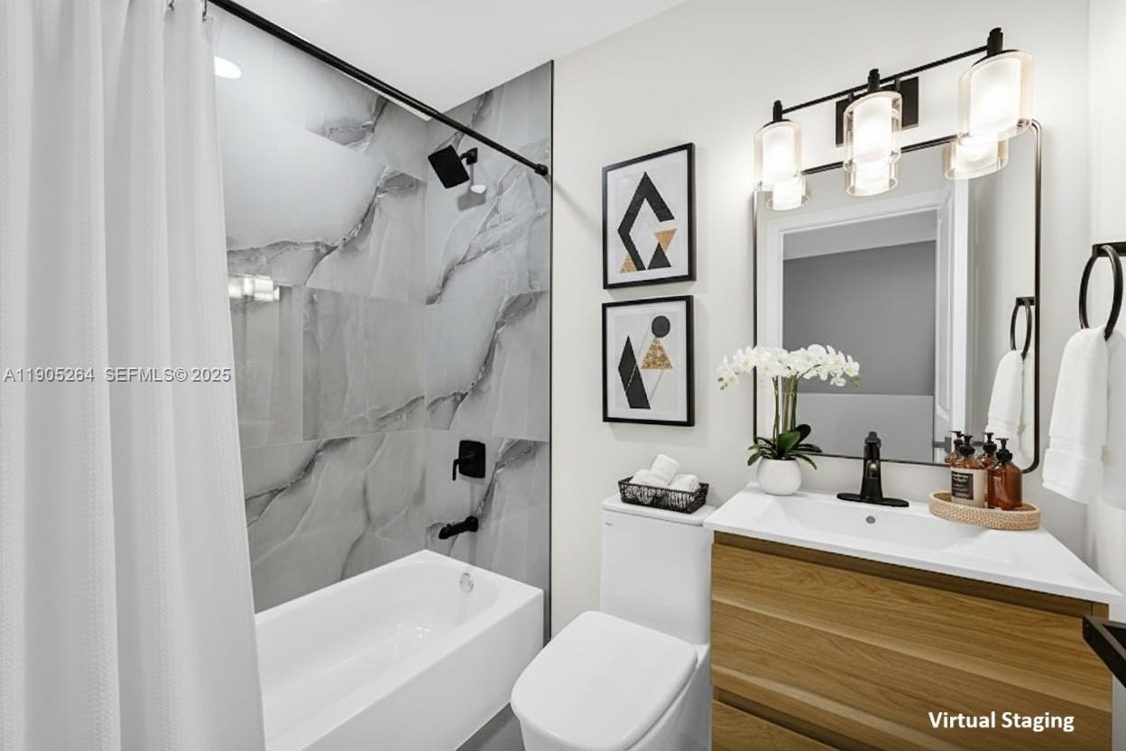 10823 Southwest 147th Court Miami, FL 33196 - Photo 11 of 100 a bathroom with a sink a toilet and shower