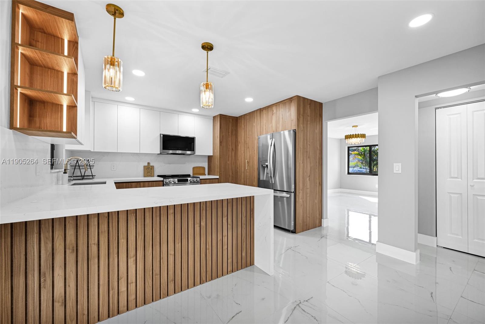 10823 Southwest 147th Court Miami, FL 33196 - Photo 25 of 100 a kitchen with refrigerator and window