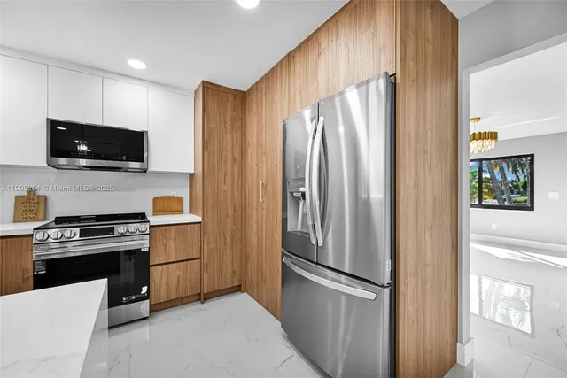 an empty room with wooden floor and window