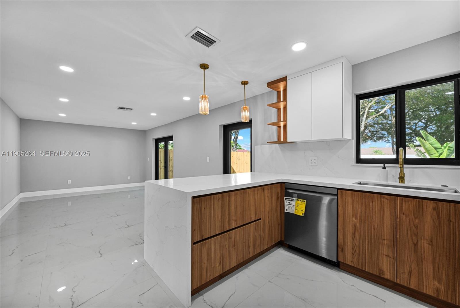 10823 Southwest 147th Court Miami, FL 33196 - Photo 37 of 100 a kitchen with a sink stove and cabinets