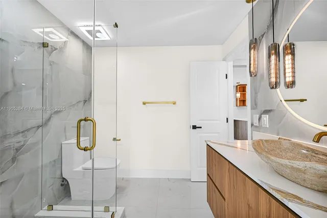 a view of backyard with table and chairs and wooden fence