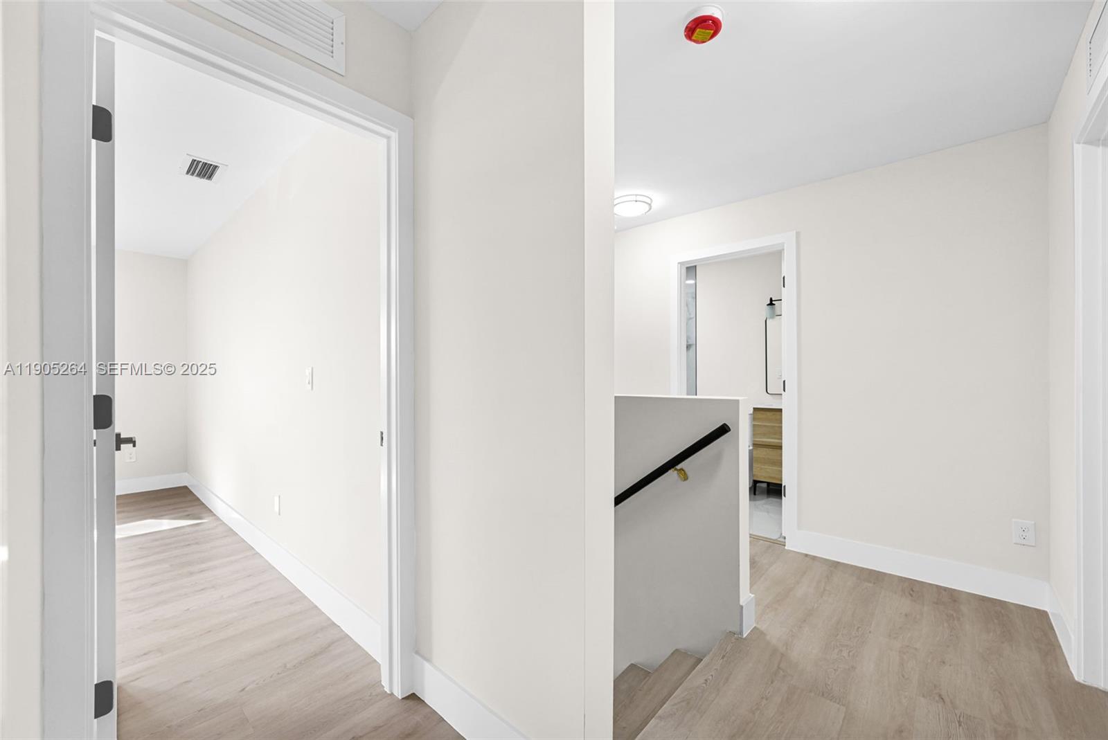 10823 Southwest 147th Court Miami, FL 33196 - Photo 53 of 100 a view of a hallway with wooden floor and staircase