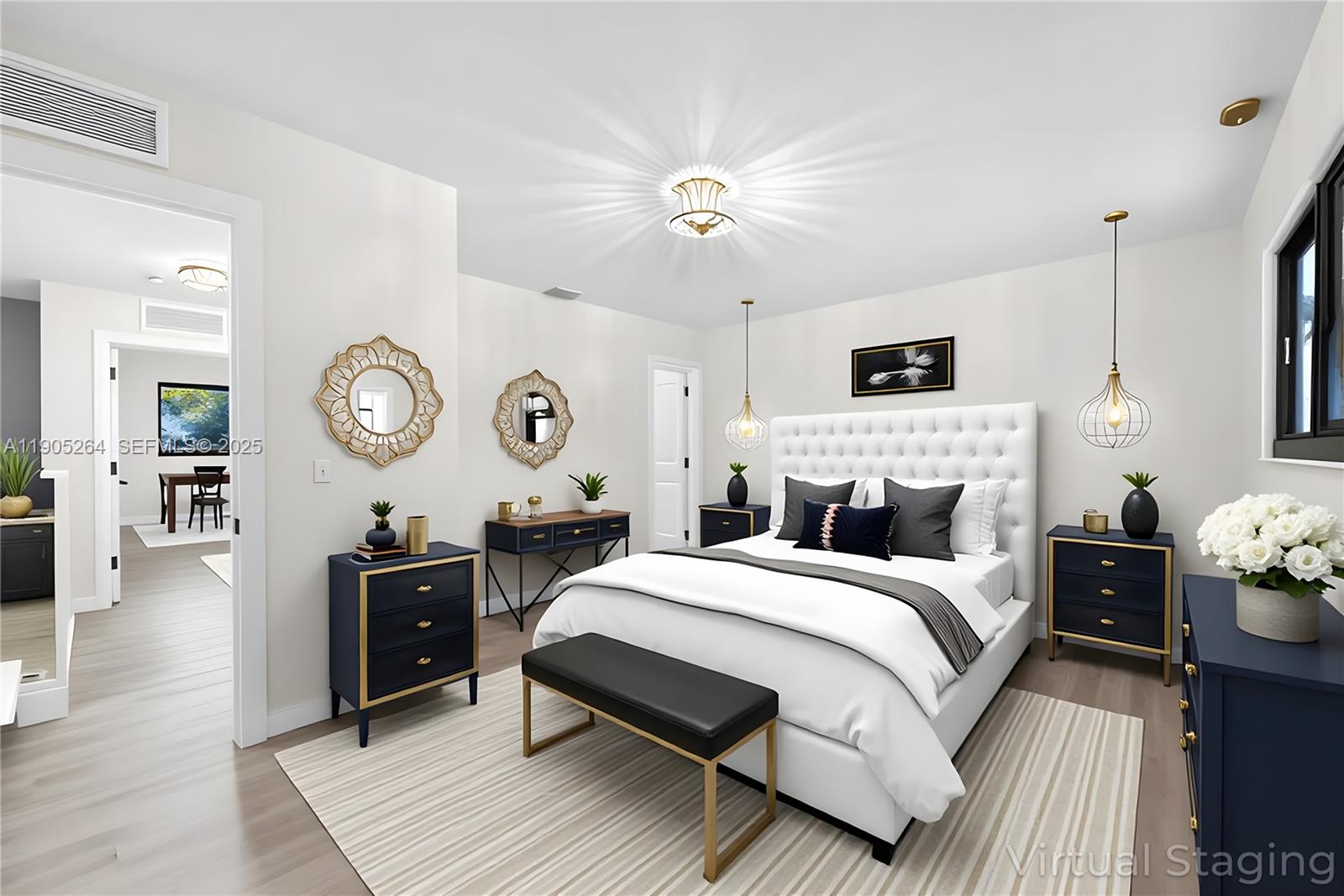 10823 Southwest 147th Court Miami, FL 33196 - Photo 6 of 100 a bedroom with a bed a mirror on dresser and a chandelier