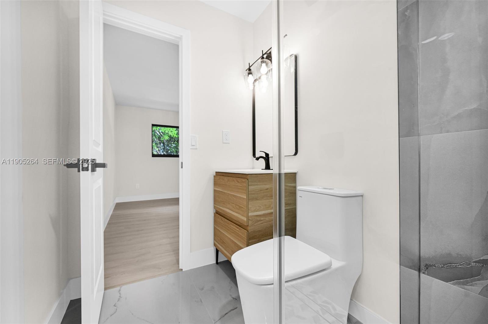 10823 Southwest 147th Court Miami, FL 33196 - Photo 63 of 100 a bathroom with a toilet and a shower