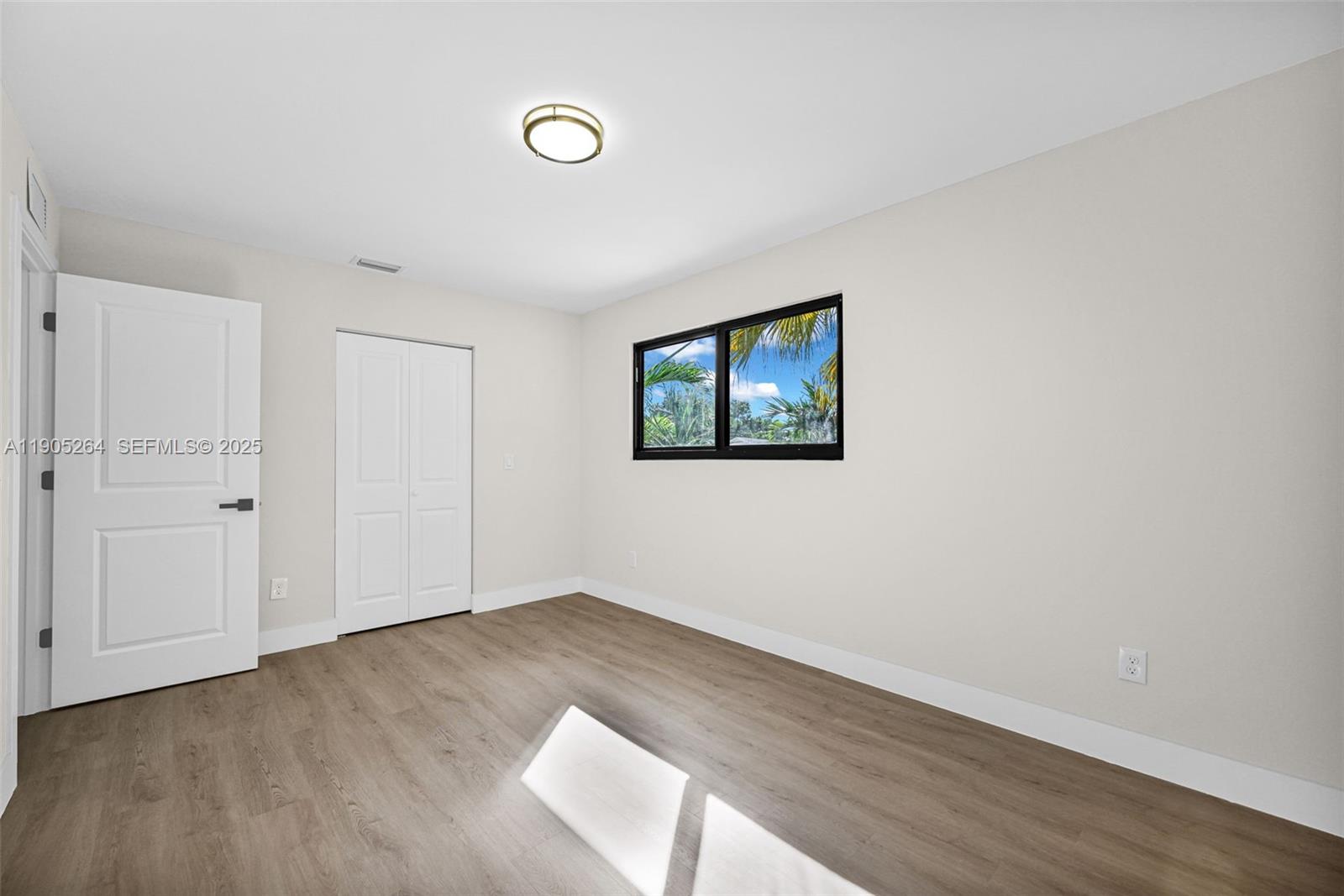 10823 Southwest 147th Court Miami, FL 33196 - Photo 78 of 100 a view of empty room with wooden floor