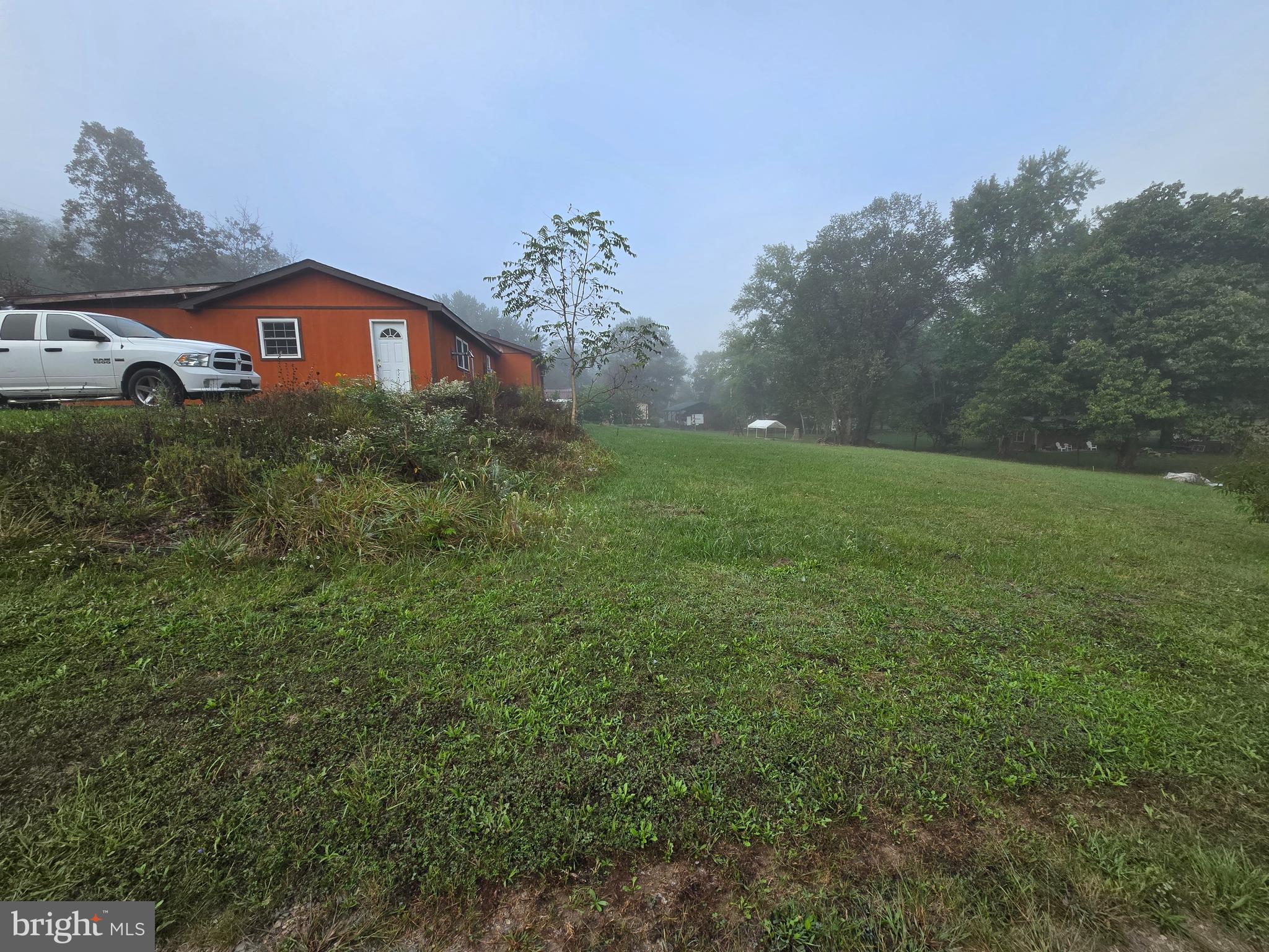 3165 Springfield Pike Springfield, WV 26763 - Photo 6 of 16 a view of a house with a yard