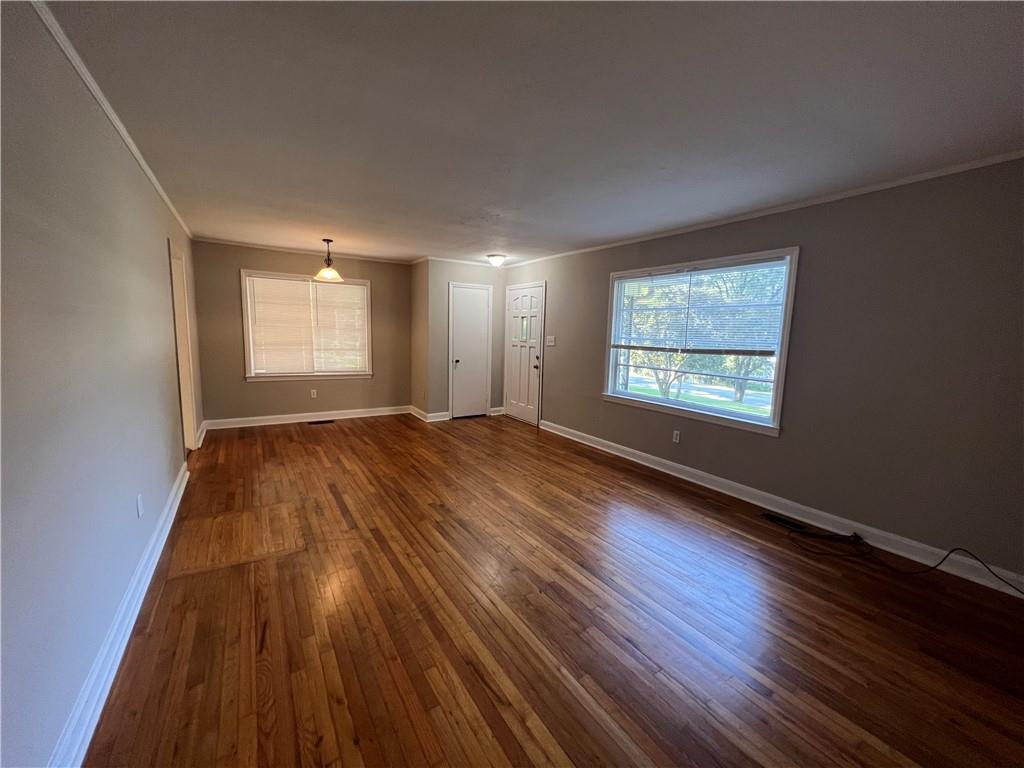 434 Christopher Drive Gainesville, GA 30501 - Photo 3 of 11 an empty room with wooden floor and windows